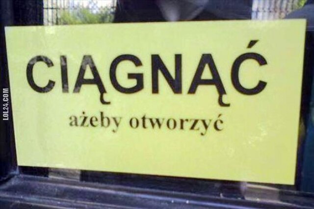 napis, reklama : Ciągnąć, ażeby otworzyć