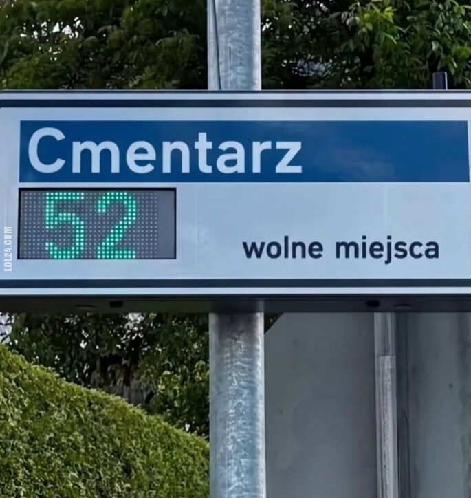 napis, reklama : Cmentarz, wolne miejsca