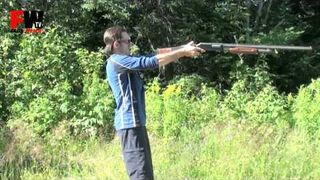 Holding a shotgun like a handgun