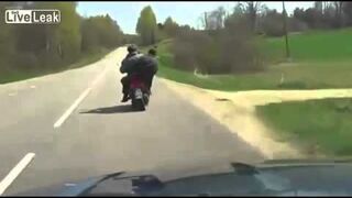 Russia Two drunk men on a scooter fall after honking